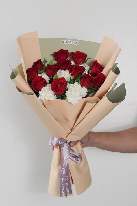 This stunning bouquet of gorgeous red roses mixed with delicate white carnations would definitely leave her in awe and speechless. Leaves Bouquet, White Carnations, Carnation Bouquet, Pink Flower Bouquet, White Carnation, Red Carnation, Bridal Bouquet Flowers, Red Rose Bouquet, Gift Delivery