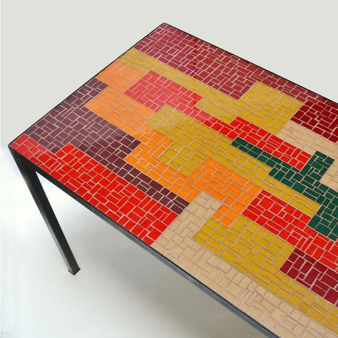 Mosaic coffee table with strong abstract design a well balanced palate in black, red, orange salmon and ochre pieces of rectangular and square pieces of glass creating a striking pattern in horizontal and vertical directions. The elegant frame is in black metal. Geometric Mosaic Art, Square Tile Mosaic Patterns, Cool Mosaic Designs, Square Mosaic Patterns, Mosaic Countertops, Mosaic Table Top Designs, Modern Mosaic Art, Mosaic Designs Pattern, Metal Table Frame