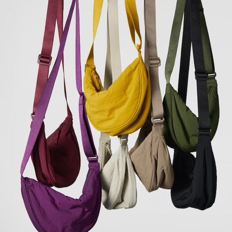 UNIQLO Round mini shoulder bag. Crossbody bag, Fanny pack, colors, purple, yellow, cream, nude, green, black, red, beige Follow my shop @saly on the @shop.LTK app to shop this post and get my exclusive app-only content! #liketkit #LTKunder50 #LTKitbag #LTKtravel @shop.ltk https://liketk.it/4chz4 Uniqlo Bags, Jean Large, Shoulder Pain, Mini Shoulder Bag, Nylon Bag, Unisex Design, Fashion Clothes, Hobo Bag, Sling Bag