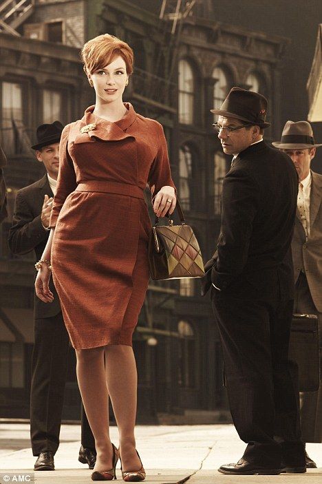 Eye-catching: Christina Hendricks dazzles her male admirers in a scene from Mad Men Joan Mad Men, Joan Harris, Joan Holloway, Womens Suit, Sofia Loren, Mad Men Fashion, Kat Dennings, Weiners, Serge Gainsbourg