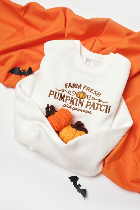 Beautifully crafted Embroidered Pumpkin Patch Sweatshirt For Halloween! Embrace the festive spirit with this cozy sweatshirt featuring embroidered pumpkin patches.  *Three-needle stitched collar, shoulders, armholes, cuffs, and hem. *50% cotton, 50% polyester. *Sizes are unisex. * PLEASE NOTE that sizes run a bit smaller than regular US sizes. Make sure to check measurements in the last picture to find your desired size. *I'd suggest sizing up for a more relaxed fit. *This design is not customiz Embroidered Pumpkin, Patch Sweatshirt, Pumpkin Patches, Halloween Crewneck, Trendy Shirt Designs, Patches Shirt, Halloween Sweater, Embroidered Crewneck, Cute Sweatshirts