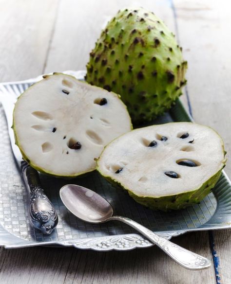 Cherimoya has soft, sweet, white flesh with several large black seeds and a tropical flavor described as a mixture of banana, pineapple, papaya, coconut, mango. It is rich in Vitamin C, B and powerful minerals.  http://lifecare.eu.com/ Weird Fruit, Strange Fruit, Rican Food, Exotic Food, Fruit Plants, Exotic Fruit, Tropical Fruits, Healthy Fruits, Delicious Fruit