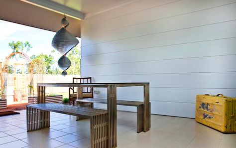 Stria 325mm horizontal cladding looks great in this eclectic outdoor area, adding a modern take on a classic weatherboard look. Stria Cladding, Outdoor Feature Wall, Horizontal Cladding, Timeless Home Exterior, Hamptons Homes, House Renos, Hamptons Style Homes, Building Facades, Renovation Tips