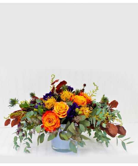 This vibrant arrangement brings all the warmth of an amber-touched fall afternoon. Filled with roses, protea, eucalyptus, and so much more, this heartfelt arrangement is the perfect gift for your loved ones. Fall Flower Centerpieces, Thanksgiving Flower Arrangements, Thanksgiving Floral Arrangements, Fall Afternoon, Thanksgiving Floral, Thanksgiving Flowers, Small Flower Arrangements, Corporate Flowers, Fall Flower Arrangements