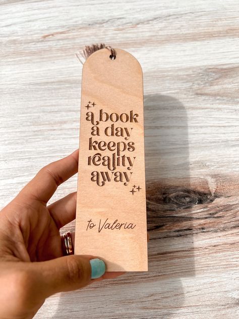 If you wish not to add personalization to this item, please enter “N/A” in the text box. These laser engraved wooden bookmarks are the perfect gift for any book lover. With the option to personalization, you can give it even a more personal and unique look. These bookmarks make the difference from any other regular one of its kind. You can choose from different color tassels to give it an even more personal look. **Dedication at the bottom is optional** SIZE 2” Wide x 7” Long 0.06” Thick If you Cricut Bookmarks Leather, Book Lover Bookmarks, Handmade Gifts For Book Lovers, Wood Book Marks, Diy Wooden Bookmark, Book Cricut Ideas, Sayings For Bookmarks, Glowforge Bookmark, Laser Engraved Bookmarks