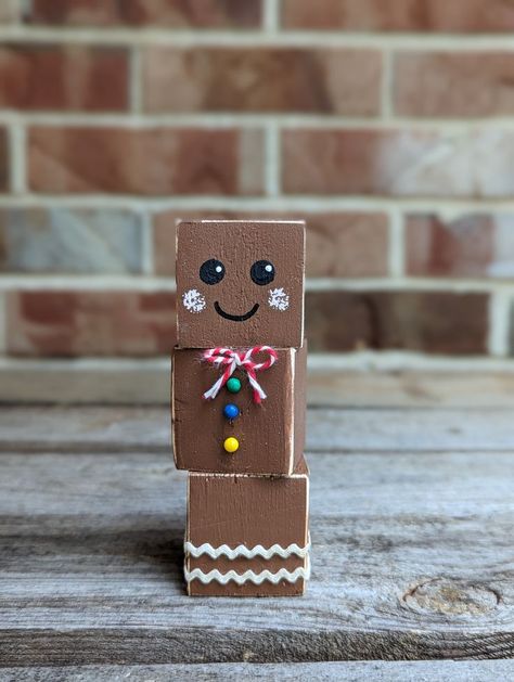 Small Gingerbread Cookie Home Decor Choose quantity: 1, 3 or 5 Hand painted face, pushpin buttons & a bow tie Measures approximately 4.25" tall & 1.5" wide & deep Handcrafted, no two are the same For indoor use Mini Block Crafts, Easy Wood Block Crafts, 4x6 Wood Projects, Small Christmas Crafts To Sell, Dollar Tree Wooden Cube Crafts, Small Jenga Block Crafts, Foam Dice Dollar Tree Crafts, Gingerbread Blocks, Jenga Painting Ideas