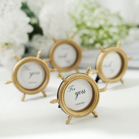 PRICES MAY VARY. Quantity: 4 Mini Photo Frames Material: Resin Color: Gold Frame Style: Ship Wheel Overall Size: 3.5"L x 3"W Photos Size: 1.75" Dia. Number Of Spokes: 6 Features: Sturdy, Durable, Portable and Lightweight They are equipped with backing to fit your favorite photos Easel on the back for the frame to stand on it's own Multi-Use: Picture Frame, Place Card Holder, Photography Prop and more! Safe Material: These frames are light but firm, have resin body instead of glass. When they fal Nautical Wedding Centerpieces, Nautical Party Favors, Nautical Wedding Favors, Round Picture Frames, Mini Photo Frames, Nautical Birthday Party, Nantucket Wedding, Yacht Wedding, Nautical Wedding Theme