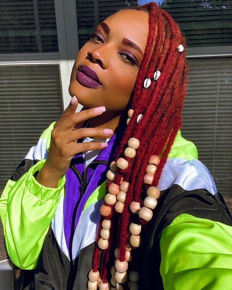 Jazz up a fresh retwist by adding some jumbo beads and cowrie shells to your locs. Beads On Locs, Loc Beads, Loc Hairstyles, Cowry Shell, Cowrie Shells, Cornrow, Locs Hairstyles, Hair Beads, Cowrie Shell