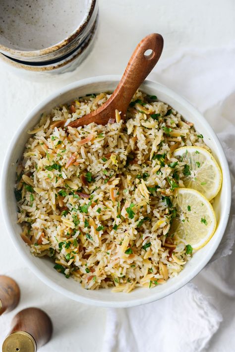 Greek Lemon Rice Pilaf is a flavorful pasta and rice side dish. Toasted orzo and rice cook with garlic and onions simmer in broth before being tossed with minced parsley, lemon zest and juice. This simple, one-pot rice and pasta dish is easy, versatile and goes with just about everything. Like any good recipe, it starts […] Parsley Rice Recipe, Lemon Rice Pilaf, Greek Rice Pilaf, Rice Pilaf With Orzo, Toasted Orzo, Greek Rice, Greek Lemon Rice, Basmati Rice Recipes, Cypriot Food