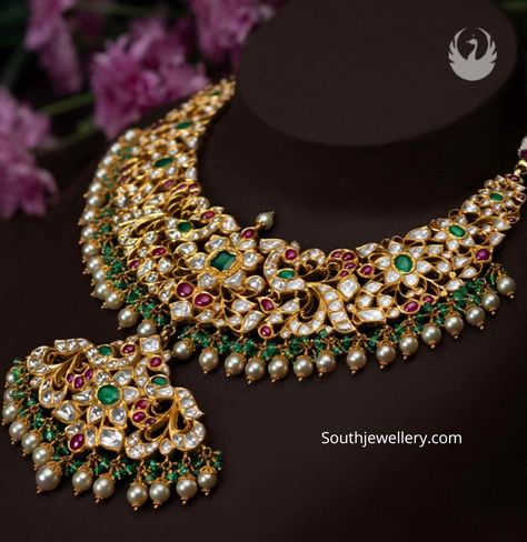 22k gold antique peacock and floral design necklace adorned with polki diamonds, rubies, emeralds, hanging green beads and south sea pearls by PMJ jewels. Pmj Jewels Jewellery, Green Emerald Necklace Indian, South Jewellery Designs, South Indian Jewellery Necklace Set, Green Beads Jewellery Designs, Kundan Jewellery Bridal, Gold Peacock, Antique Gold Jewelry Indian, Indian Bridal Jewelry Sets