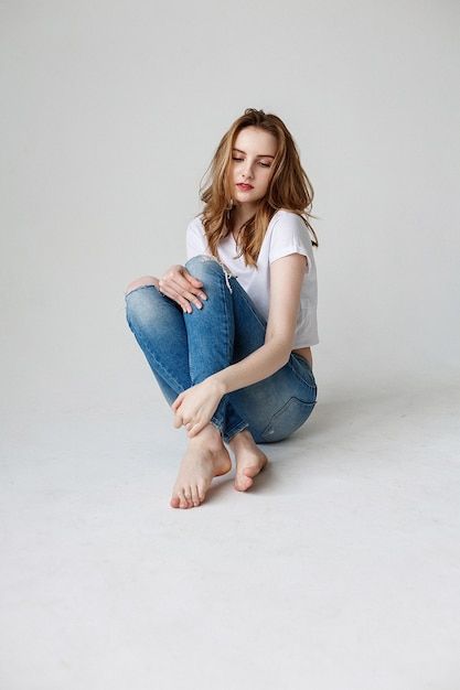 Sit Pose, Studio Floor, Jeans Girl, Anatomy Models, Woman Posing, Blue Ripped Jeans, Model Test, Beige Coat, Woman Sitting