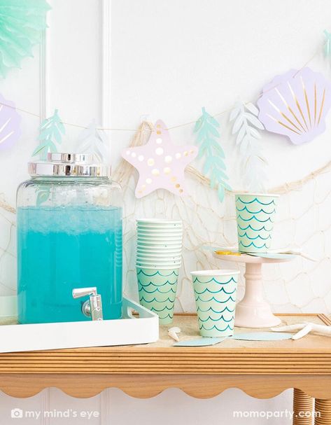 Get your party started with these Mermaid Tail Paper Party Cups! With an adhesive tail and aqua foil, these cups are perfect for any under the sea themed celebration. Embrace your inner mermaid and make a splash with these quirky and fun cups. Pack of 8 paper cups Size: 12 oz. capacity. 4.5" tall and 3.5" round at top Aqua foil. Not suitable for microwave Includes adhesive tail Oneder The Sea Decorations, Mermaid Graduation Party, Coastal Birthday, Mermaid Party Food, Underwater Birthday, Mermaid Pool Parties, Ocean Birthday Party, Mermaid Birthday Party Decorations, Mermaid Theme Birthday Party