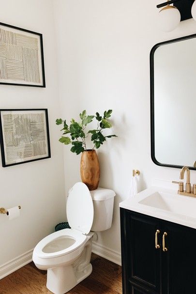 Half Bathroom Light Fixtures, White Half Bathroom Ideas, Small Powder Room Ideas Modern, Half Bathroom Ideas Modern, White Half Bathroom, Black And White Half Bathroom, Modern Half Bathroom Ideas, Black Half Bathroom, Modern Half Bathroom