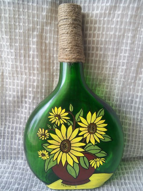 Acrylic painting on bottle...The bottle is painted with acrylic paint and the jute twine around the neck of the bottle gives it  a rustic look. This can be used as home decor. Green Bottle Painting, Glass Bottle Painting Acrylics, Painting On Bottles, Bottle Paint, Beer Bottle Crafts, How To Paint Flowers, Easy Yarn Crafts, Painting Glass Jars, Hand Painted Wine Bottles