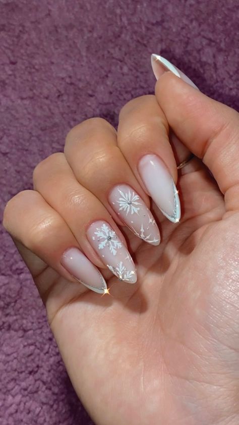 Snowflake Nails With Rhinestones, Almond French Tip Nails With Snowflake, Snowflake Stiletto Nails, Almond Nails Snowflakes, Snow Queen Nails, Ice Princess Nails, Icicle Nails Acrylic, Snow Themed Nails, Frozen Nails Disney