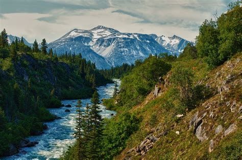 The landscape in Yukon is gorgeous. There are snow covered mountains, volcanoes, forests, cold water rivers, glaciers, snowmelt lakes, the largest icefield in Canada, and many more beautiful landforms. Surface Mining, Whitehorse Yukon, Snow Covered Mountains, Yukon River, Arctic Tundra, Yukon Territory, Northwest Territories, The Rockies, Arctic Circle