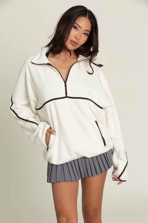 Best Selling Ivory Minimalistic Half-Zip Pullover is an absolute game changing staple you will find yourself living in! It has a trendy, minimalistic vibe with its ivory color and cream line details. It features dual side pockets, half-zip closure and a soft, fleece material that is so warm. The fit is slightly oversized too, which is amazing! Pleated Tennis Skirt, Clothing Haul, Tennis Skirts, Half Zip Sweatshirt, Half Zip Pullover, Find Yourself, Athletic Outfits, Tennis Skirt, Ivory Color