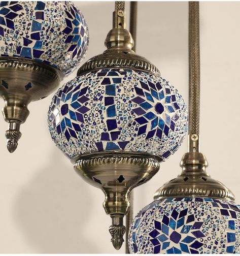 Introducing our exquisite 7 Globes Turkish Mosaic Lamp, meticulously handcrafted to elevate the ambiance of your living space with its timeless elegance. Each globe is a masterpiece, painstakingly assembled from an array of vibrant stained glass pieces, ensuring a lasting allure that transcends trends. The superior craftsmanship extends to the durable metalwork, guaranteeing a rust-free lifespan. Rest assured, every component of our lamps is sourced locally and rigorously tested in USA, ensuring Retail Gift Turkish Lamp And Showpiece, Mosaic Chandelier, Turkish Lights, Turkish Mosaic Lamp, Turkish Mosaic, Turkish Tile, Elegant Living Room Design, Turkish Lamps, Mosaic Lamp