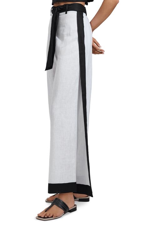 These wide-leg cover-up pants crafted from lightweight linen are a must-pack companion for your next sunny getaway. 29" inseam; 28" leg opening; 13 1/2" front rise; 16" back rise (size 8) Zip fly with button closure Removable tie belt 100% linen Machine wash, dry flat Imported Wide Leg Linen Trousers, Linen Wide Leg Pants, Denim Essentials, Black Knit Dress, Wide Leg Linen Pants, Linen Trousers, Tie Shoes, Side Stripe, Linen Clothes