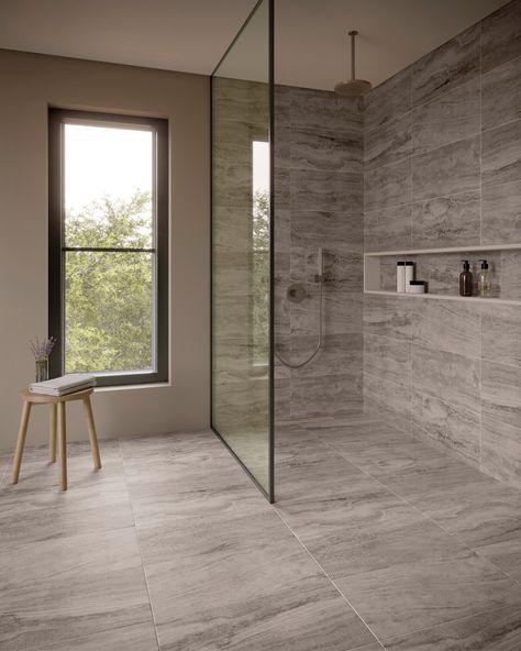 Get the look of natural stone with this beautiful Stellar Gray Porcelain Tile. This 12 x 24 tile comes in gray and has a matte finish. This tile gives you the beautiful fade-resistant variations of natural stone with the added benefit of easy maintenance. It’s already resistant to staining, so there’s is no need to seal this tile. Plus, this stone-look tile is engineered to last and able to withstand heavy foot traffic. This tile was made in the United States. | Castille | Stellar Grey Porcelain Master Bath Grey Tile, Dark Gray Porcelain Tile Floor, Regency Gray Porcelain Tile, Large Gray Shower Tile, Xl Porcelain Tile, Bathroom Design Large Tiles, Light Gray Bathroom Tile Floor, Onyx Porcelain Tile Bathroom, Showers With Glass Walls