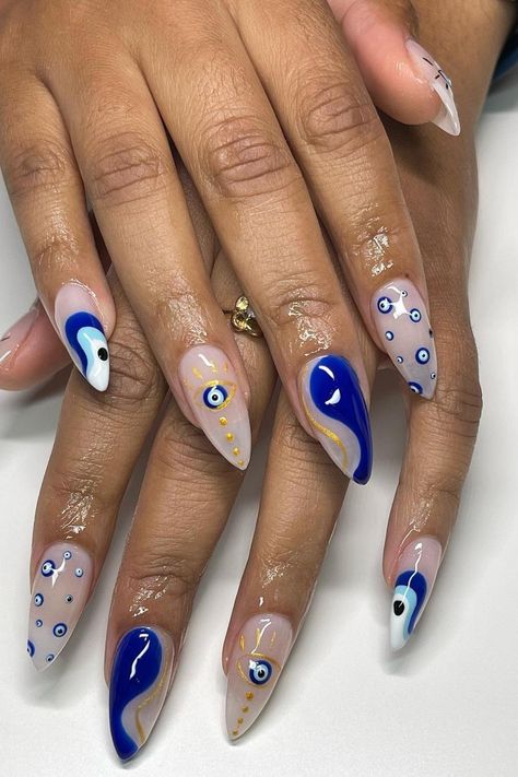 Nail Design With Evil Eye, Dark Blue Nails Evil Eye, Evil Eye Nails With Gold, Evil Eye White Nails, Navy Halloween Nails, Greek Inspo Nails, Gel Nails Evil Eye, Evil Eye Almond Nails, Evil Eye Gel Nails