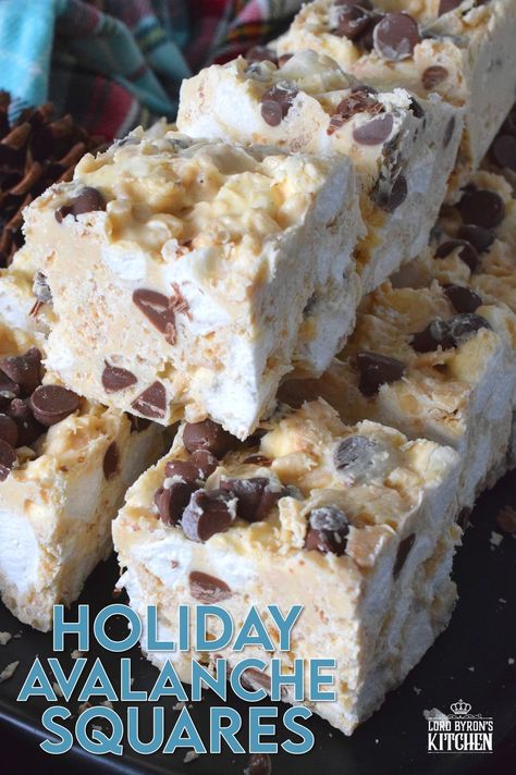 These no-bake treats are prepared with lots of white chocolate, creamy peanut butter, a few cups of rice cereal, and a good helping of marshmallows too. Holiday Avalanche Squares are absolutely delicious! The white chocolate is melted together with the peanut butter, and once cooled, the other ingredients are folded in to create these wonderfully high and cloudy-soft squares! #squares #bars #nobake #christmas #holiday #baking #cookies #chocolate White Chocolate Rice Krispy Marshmallow, Holiday Avalanche Squares, No Bake Holiday Marshmallow Bars, Christmas Baking With Marshmallows, White Chocolate Squares, No Bake Squares And Bars Recipes, Holiday Squares Recipe, White Chocolate Christmas Treats, Christmas Square Recipes