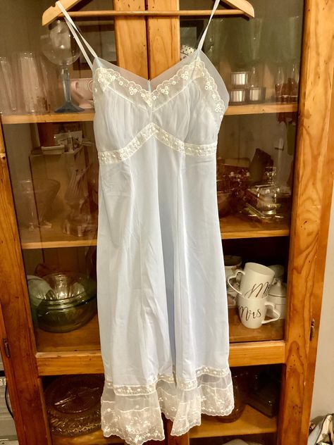 Gorgeous 1950's style nylon slip. Vintage Pale blue nylon slip. The back is square cut with non adjustable straps Very sweet and feminine. In excellent condition.  ERA 1950s FABRIC Nylon Label Reads: Bry-Nylon                          Chic Salon 34 Condition Excellent   No marks, no stains, no tears.   I post worldwide except for Germany. Thank you for your understanding.                                           Measurements: Bust 86cm/34inches  Waist 73cm/28.5 inches Length from underarm 82cm/ Vintage Blue Dress, 1950s Fabric, 1950s Woman, 60s 70s Fashion, Lingerie Vintage, Womens Lingerie, Vintage Slip, 50s Style, Vintage Slips