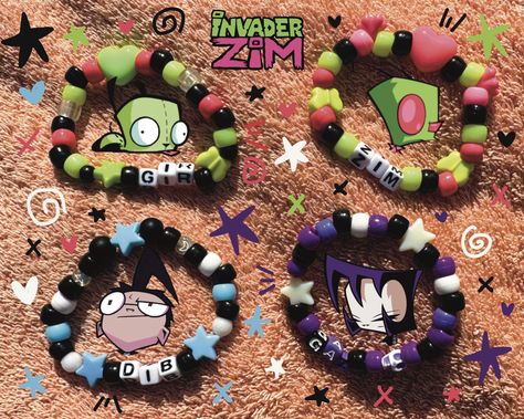 Kandi based on Invader Zim! Zim, Gir, Dib Membrane, and Gaz Membrane, as well as any other custom character!! PLUR (*'ω'*) Some of my kandi is one of a kind, as I recycle some beads from bracelets I purchase 2nd hand. I will probably redesign each bracelet as I run out of beads. Yours may look a little different than the pictures but will use the same colors! Order these as they are, or feel free to message about changing or adding colors/beads. Also feel free to DM about customs! Kandi is stretchy & will fit most wrists, please specify the size you'd like if needed. Kandi Invader Zim, Gir Bracelet Kandi, Beads On Safety Pins, Invader Zim Kandi Pattern, Gir Kandi Cuff, Domo Kandi Pattern, Gir Kandi Cuff Pattern, Invader Zim Bracelet, Gir Kandi Pattern