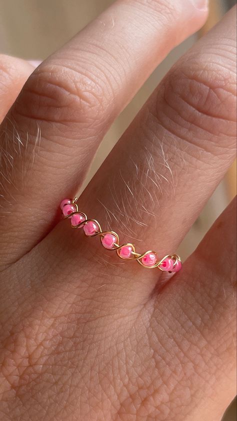 An easy DIY tutorial for a cute pink beaded wire ring - follow along DIY to make easy rings with beads Elastic Rings Diy, Cute Handmade Pink Rings, How To Make A Rose Ring Out Of Wire, Easy Wire Rings, Diy Beaded Rings Tutorials, Beaded Wire Rings, Pink Beaded Rings For Gift, Wire Ring Diy, Bead Wire Ring