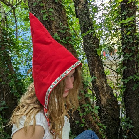 Whimsical and fun handmade pixie hats, the perfect accessory for adding a touch of magic to your winter wardrobe. These unique triangular-shaped hats are made of red cotton corduroy and lined with soft cotton flannel. Reversible and trimmed with playful woven jacquard ribbon ties, these hats are perfect for a Halloween costume or everyday dress up.  The two sets of snaps at the chin ensure a secure fit, with no ties or bows to fuss with. Whether you want to dress up as a fairy, gnome, or elf, th Gnome Cosplay, Garden Gnomes Costume, Gnome Costume, Hat Halloween Costume, Costume Toddler, Girl Elf, Gnome Hat, Red Garden, Pixie Hat