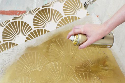 Applying gold spray paint through a stencil. How To Decorate A Sideboard, Diy Art Deco, Ikea Dresser Makeover, Sideboard Upcycle, Art Deco Stencil, Deco Sideboard, Straw Marquetry, Art Deco Dresser, Painting Wooden Furniture