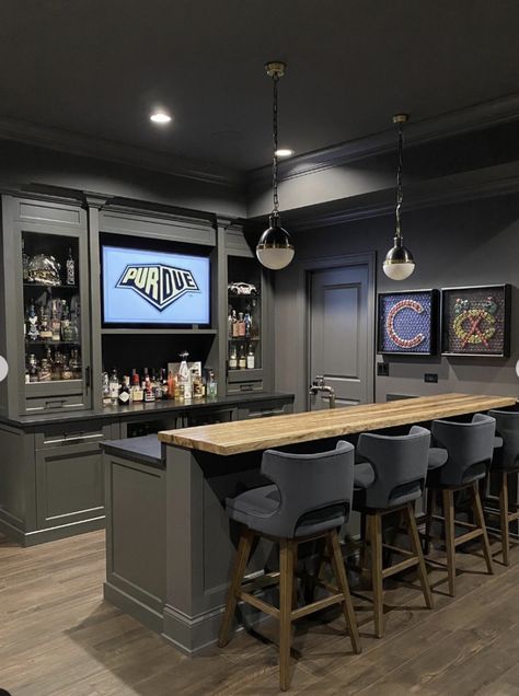 25 Basement Bar Ideas You Should Try Bar Ideas For Garage Man Cave, Basement L Shaped Bar Ideas, Bar Room Ideas In House Luxury, Basement Bar Designs Layout, Black Basement, Basement Wet Bar Ideas, Small Basement Bar, Small Basement Bar Ideas, Garage Bar Ideas