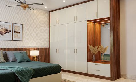 7 Fabulous White Wardrobe Design Ideas For Your Bedroom on Design Cafehttps://www.designcafe.com White And Wooden Wardrobe Design, White And Brown Cupboards Bedroom, White Bedroom Wardrobe Ideas, White Sunmica Wardrobe, White Wadroob Design Bedroom, Wood Colour Wardrobe Design, White And Wooden Wardrobe, White Wardrobe Design Bedroom, Roorkee City