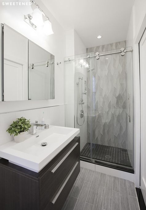 East Village bath features Italian ceramic floor tiles, rippled gray wall tiles, frameless glass shower door with chrome finishes, and wall-mounted sink vanity. Arabesque Tile Floor, Makeover Kamar Mandi, Gray Tile, Wet Room, Small Bathroom Makeover, Modern Farmhouse Bathroom, Bathroom Remodel Shower, Small Bathrooms, Bathroom Redo