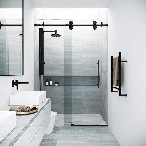 Model size: shower door fits shower opening widths 44-in – 48-in; door height is 74-in; door opening width – 19.5-in. Adjustable RollerDisk™ technology: this model features round sliding roller disks with 3/8 inch built-in adjustability to accommodate out-of-plumb walls and allow for an easy, frustration-free installation. Reversible installation: shower door can be installed with left side opening or right side opening based on customer's preference. Glass type: ANSI Z97.1 and 16 CFR 1201-certi Black Shower Doors, Frameless Sliding Shower Doors, Modern Bathroom Remodel, Frameless Shower Door, Tub Doors, Frameless Shower Doors, Sliding Shower Door, Black Shower, Frameless Shower