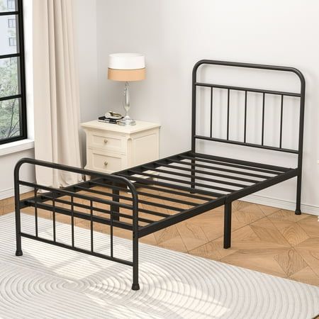 Ardent Twin Metal Spindle Bed Black, Adult. This modern styled bed features curved lines and thick tube frames, bringing a romantic and warm feeling to your space. The beautiful silhouette subtly balances the coolness of metal that is easily blended with modern, traditional, farmhouse and rustic home decors. Compared with other metal beds, this queen size bed frame has a higher headboard for better protecting your head and providing you a comfortable sitting place. Carefully designed, this mattress foundation is built of round corners, smooth finish and protective footpads, which is safer for our customers to use. This robust bed base is fully constructed of metal frame for large load-bearing capacity. Reliable frame features with 10 metal slats & 2 reinforcing tubes, which provides you wi Black Bed Frame Twin, Black Twin Metal Bed Frame, Black Metal Twin Bed, Black Twin Bed, Twin Metal Bed Frame, Modern Traditional Farmhouse, Styled Bed, Twin Beds For Boys, Metal Twin Bed