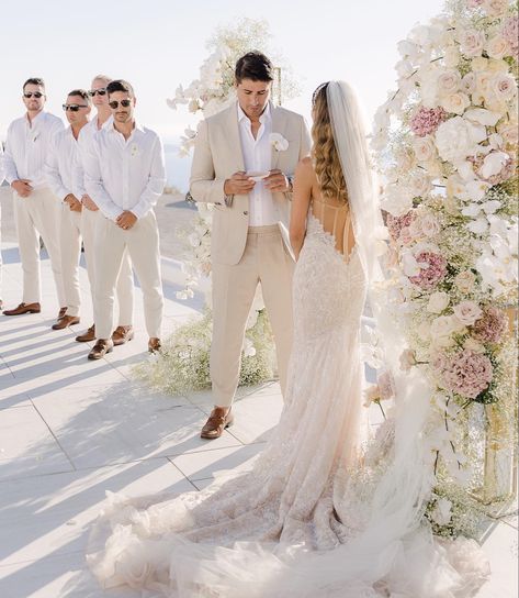 Bride and groom say do personal vows Groom Sand Suit, Groomsmen Suits Beach Wedding, Cream Color Groom Suit, Cream Tux Wedding, Destination Wedding Tuxedo, Beige Suit For Groom, Light Beige Groomsmen Suits, Tan Suites Wedding, Bride And Groom White Attire