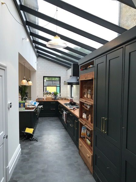 Bespoke rectangular roof lantern sits above a dining area. Lean To Roof, Industrial Kitchen Design, Roof Lantern, House Extension Design, Industrial Interior Design, Kitchen Extension, Black Cabinets, House Extensions, Open Kitchen