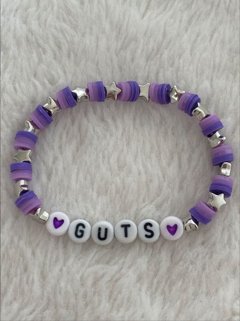 NOT MY PHOTO!! ❌ Guts Your Bracelets, Sour Bracelets Olivia Rodrigo, Olivia Rodrigo Guts Tour Bracelets, Bracelet Small Beads, Themed Beaded Bracelets, Bracelets Inspo Beads, Clay Bead Bracelet Ideas Olivia Rodrigo, Bracelet Ideas Olivia Rodrigo, Oliva Rodrigo Bracelet