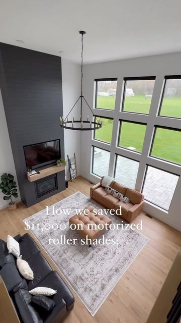 Amanda Stein on Instagram: "Our original quote for these motorized roller shades from @budget_blinds_official was over $15,000 for the 19 windows we needed. HECK NO. We frantically researched and came across @dbdliving who has these incredible motorized roller shades from @levolor . They are battery operated so no need for outlets and can be easily controlled from your phone or the remote. We purchased them from Lowes on Black Friday when they were 50% off and were able to get all 19 windows for Blinds With Black Windows, Black Roller Shades, Black Windows With Blinds, Motorized Blinds For Windows, Motorized Window Blinds, Roller Shades Living Room, Windows With Blinds, Motorized Roller Shades, Window Roller Shades