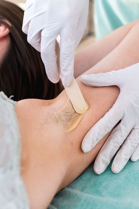 A close up of a professional waxing a woman's underarm Wax Spa, Underarm Waxing, Spa Marketing, Skin Aesthetics, Waxing Services, Facial Waxing, Business Photoshoot, Brazilian Waxing, Wax Hair Removal