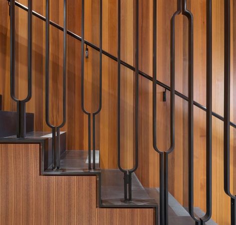 This modern black steel balustrade has a u-shaped design, adding an artistic touch to the home. #Stairs #StairDesign #SteelStairs #Handrail #SteelHandrail Bachelor House, Stairs Steel, Stairs Handrail, Steel Stair Railing, Metal Stair Railing, درج السلم, Steel Railing Design, Steel Balustrade, Seattle Waterfront