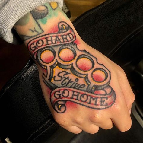 American Traditional Brass Knuckle Tattoo, Traditional Hand Tattoo Men, Traditional Brass Knuckle Tattoo, Strong Man Tattoo, Traditional Word Tattoo, Missile Tattoo, American Traditional Hand Tattoos, Foot Tattoos For Men, Old Traditional Tattoo