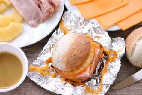 These Hot Ham and Pineapple Campfire Sandwiches are a delicious and easy tin foil recipe. Plus cleanup is a breeze! (You can even bake these in the oven too!)     *This post is brought to you … Foil Recipes, Tin Foil Meals, Camping Recipes Breakfast, Easy Camping Breakfast, Tin Foil Dinners, Campfire Breakfast, Camping Hacks Food, Foil Dinners, Camping Dishes