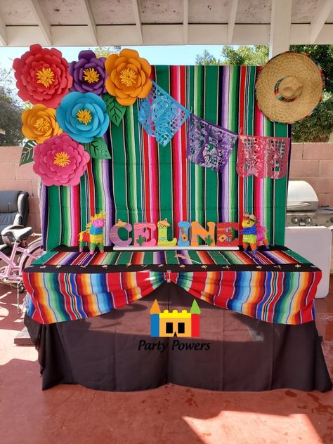 Zarape Backdrop with Paper Flowers, papel picado, and sombrero. Main table with black linen and 2 zarape runners. Great for fiesta theme party and mexican theme party. Paper Flowers Mexican Fiesta Party, Mexican Main Table Decorations, Mexican Birthday Backdrop, Mexican Paper Flowers Backdrop, Fiesta Theme Backdrop Ideas, Papel Picado Backdrop, Mexican Backdrop Ideas, Backdrop Ideas Balloons, Mexican Party Backdrop