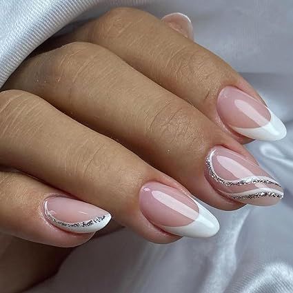 Hey there, gorgeous! 😍 Get your hands on our sassy French Tip Press On Nails. 🇫🇷💅 Rock that cute and classy look with these Almond White Fake Nails featuring Silver Curve Glue Ons. 💎 Ideal for all the lovely ladies out there, they're just perfect for any occasion - be it weddings or birthdays. 🎉 No need for acrylic gel, just stick 'em on and you're good to go! 🚀 Acrylic Nails Almond Wedding, White Grad Nails Almond, White French Tip Nails With Silver, Silver And White French Tip Nails, White And Silver Nails Almond, Beige Nails Almond, Grad Nails Almond, White And Silver French Tip Nails, Silver And White Acrylic Nails