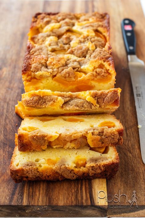 National Peach Cobbler Day: a Peach Cobbler Pound Cake Recipe your Family will Love Peach Butter Cake Recipe, Recipes With Pound Cake In Them, Angel Food Peach Cake, Peaches And Cream Loaf 12 Tomatoes, Peach Loaf Cake Recipes, Sour Cream Peach Pound Cake, Peaches And Cream Loaf Cake, Peach Cobbler Loaf Cake, Peach Breakfast Cake