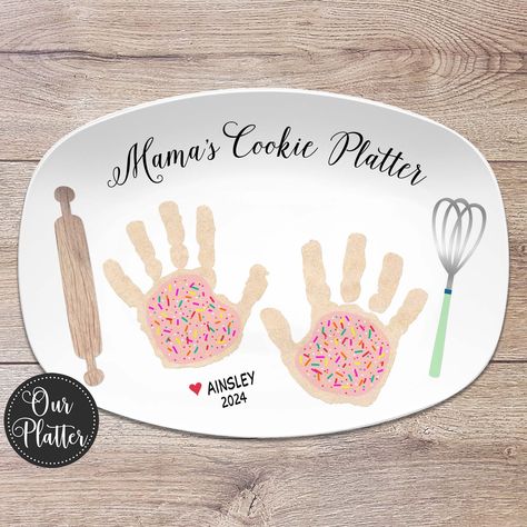 "Give a thoughtful, personalized gift featuring your own children's handprints as cookies for the thoughtful baker. This is a one of a kind special gift perfect for Mother's Day, Father's Day or other special occasion. Our 10x14\" platters are beautiful serving pieces made of a quality, durable plastic resin that is BPA-free. Dishwasher and microwave-safe.   - - - - - - - - - - - - - - - - - - - - - - - - - - - - - - - - - - -  15% OFF - MULTIPLE ORDER DISCOUNT - - - - - - - - - - - - - - - - - Handprint Cookie Plate, Diy Mother’s Day Plates, Toddler Gift To Parents Christmas, Homemade Gift Ideas For Grandparents, Family Handprint Craft, Baby Craft For Grandparent, Mothers Day Plates Ideas, Mother’s Day Plate Ideas, Grandparents Day Handprint Crafts