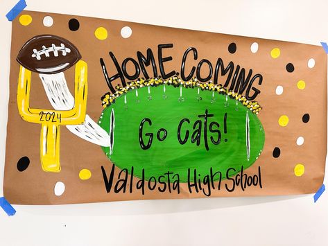 Homecoming sign, football homecoming, homecoming 2024, painted banner, painted sign, brown paper sign homecoming, football banner, football party banner, first year down banner  Please include the following in the personalization details: Wording school colors  etc  THIS LISTING IS ONLY FOR A HAND PAINTED BANNER. No balloons or other accessories will be included.  I will email a digital mock-up of your banner for final proof before I begin painting. Please send a message for rush order requests Construction Night Football Theme, Neon Run Through Signs Football, Homecoming Posters School Spirit, Beat The Bulldogs Football Signs, School Homecoming Decorations, Homecoming Football Banner Ideas, Gameday Banner Brown Paper, Homecoming Decorations Football, School Spirit Window Painting