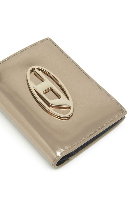 From the exterior to the metal logo plaque, this women's leather wallet gleams with a mirror-like shine. The compact, bi-fold design has a snap-fastening section for cards and notes and a quick-access coin pocket fastened with a zip.-Bi-fold style with snap closure;6 card slots;2 flat pockets;Zipped coin pocket Women Wallet, Wallets For Women Leather, Metal Logo, Small Wallet, Metallic Logo, Metallic Leather, Wallets For Women, Leather Wallet, Wallet